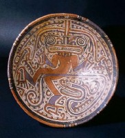 A Cocle style plate which depicts a "dancing" jaguar or masked shaman