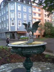Традиционный фонтан в форме василиска в г. Базель